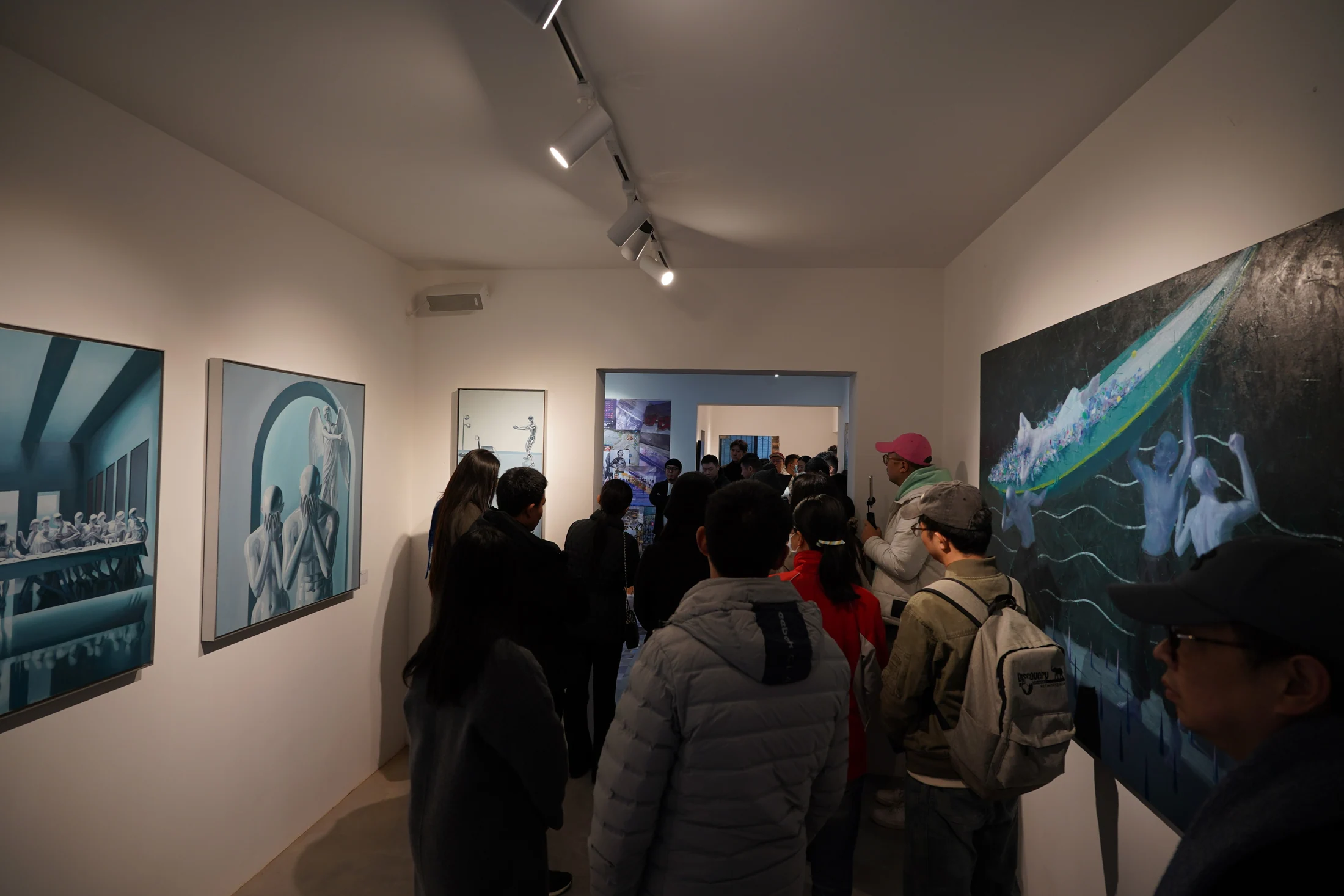 Visitors and artworks inside Faun Gallery in Chengdu